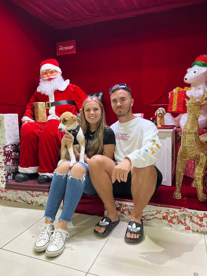 Chloe and Connor with a puppy at Christmas